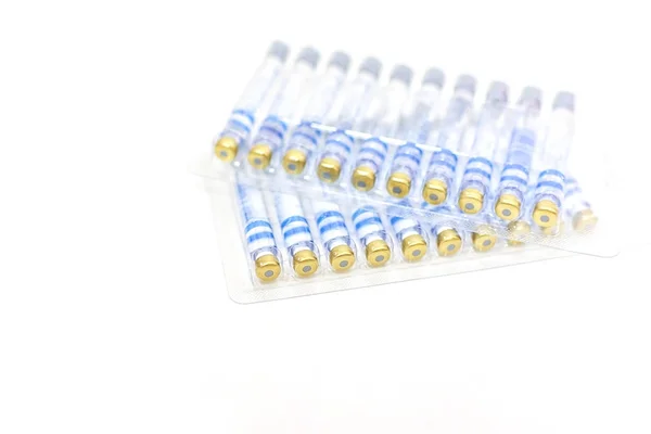 Two set of ampoules in pharmaceutical packaging