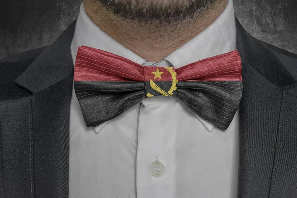 Flag of Angola on bowtie business man suit