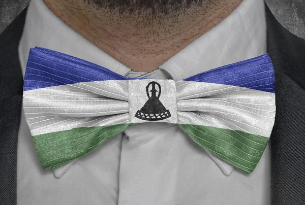 National flag of Lesotho on bowtie business man suit