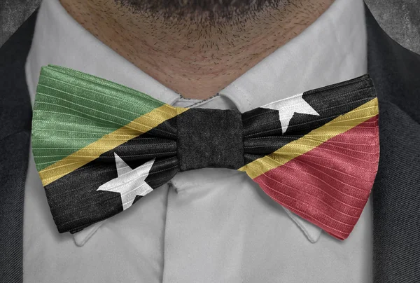 National flag of Saint Kitts and Nevis on bowtie business man suit