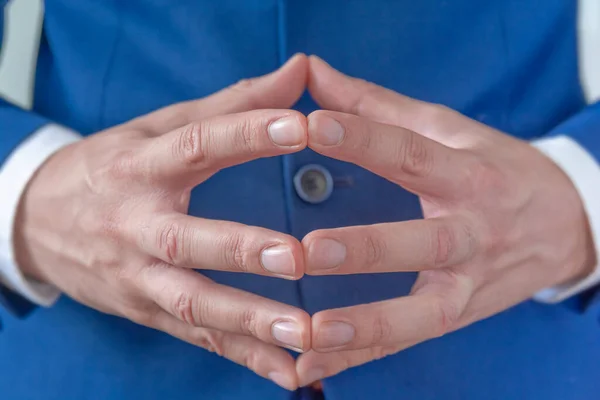 Close up of business man hands gesturing merge fingers like diamond shape