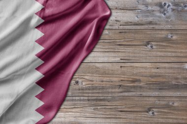 Wooden pattern old nature table board with Qatar flag