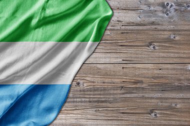 Wooden pattern old nature table board with Sierra Leone flag