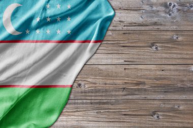 Wooden pattern old nature table board with Uzbekistan flag