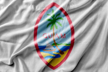 Guam Mührü 'nün ulusal bayrağını sallıyor.