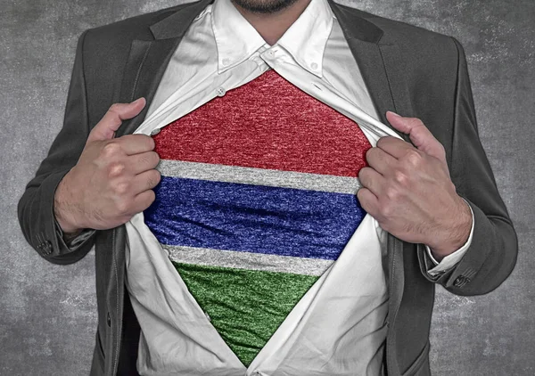 Business man show t-shirt flag of Gambia rips open his shirt