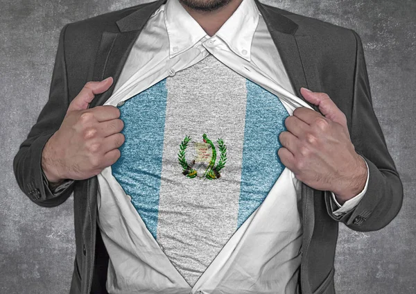 Business man show t-shirt flag of Guatemala rips open his shirt