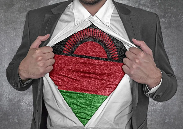 Business man show t-shirt flag of Malawi rips open his shirt