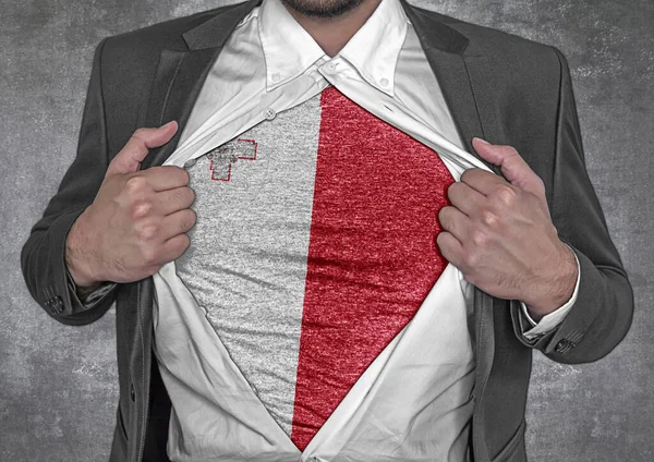 Business man show t-shirt flag of Malta rips open his shirt