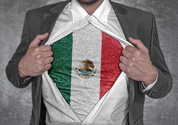 Business man show t-shirt flag of Mexico rips open his shirt