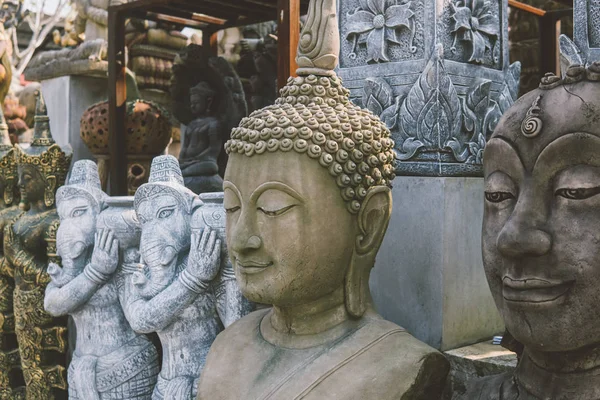 Old asian statues on the Asian market