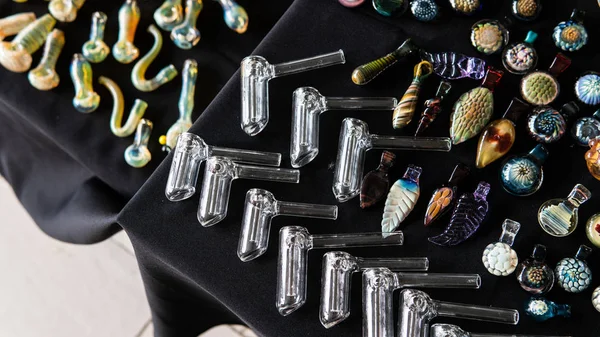 Glass smoking pipes on a black background. Design accessories fo — Stock Photo, Image