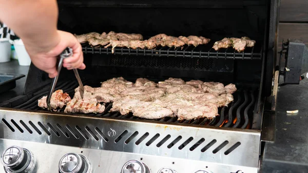Meat roasting on a big grill on the street — Stock Photo, Image