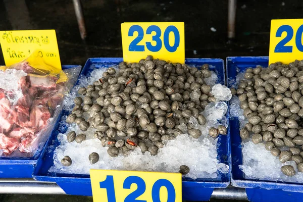 selling seafood in Asian markets. Sea crabs and a variety of fish for sale