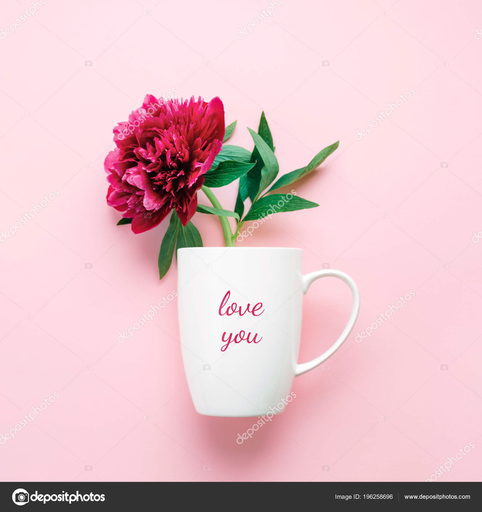 A Cup With Text Love You And Pink Flower Stock Photo