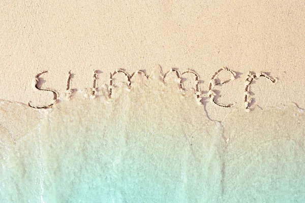 Summer written in the sea sand. — Stock Photo, Image