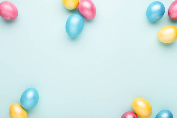 Easter eggs on turquoise background.