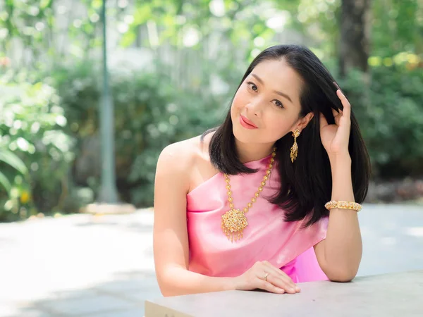 Beautiful Thai woman in Thai traditional dress.