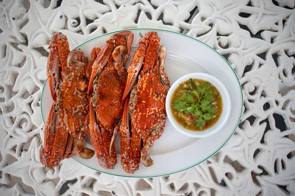 Cooked Flower crab or Blue crab with Thai seafood sauce.