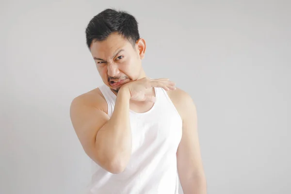 Man in white tank top with hot weather expression. Concept of hot weather of the sun in Asia. — Stock Photo, Image