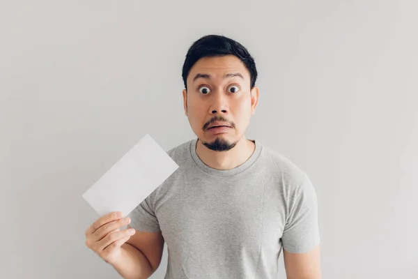 Man is shocked and surprised with the white mail message or the bill. — Stock Photo, Image