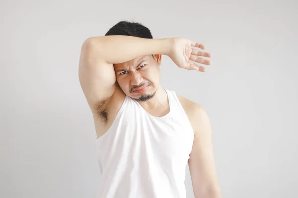 Man in white tank top with hot weather expression. Concept of hot weather of the sun in Asia. — Stock Photo, Image