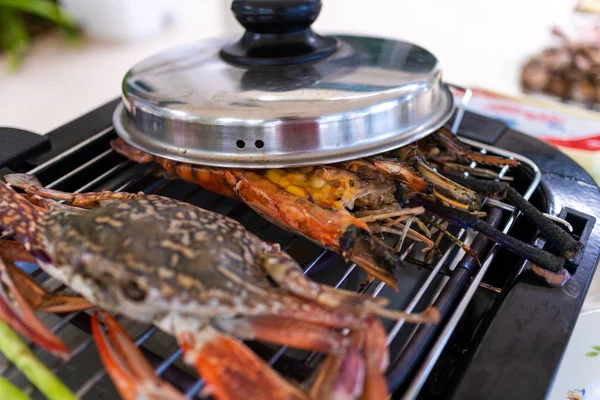 Close up of seafood barbecue on the stove.