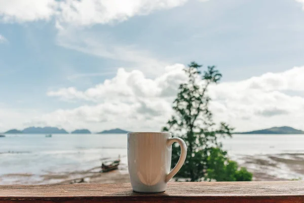 Morning coffee mug with low tide sea view. — Stock Photo, Image