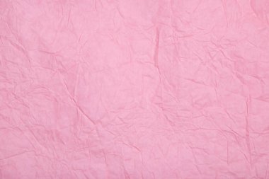 Soyut dokulu kağıt pastel pembe renk arka plan.