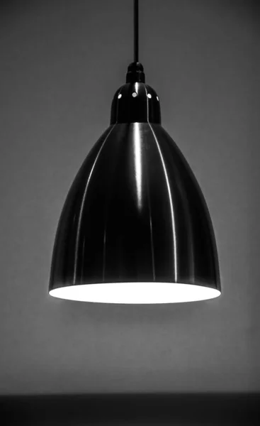Lamp, minimalism, abstraction. Black and white image. Design. A restaurant.