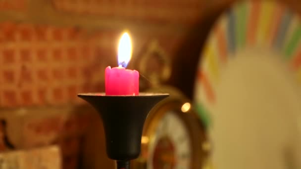 Burning Red Candle Black Candelabra Stands Brick Fireplace Clocks