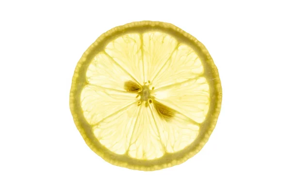 Fatia de limão retroiluminada no fundo branco — Fotografia de Stock