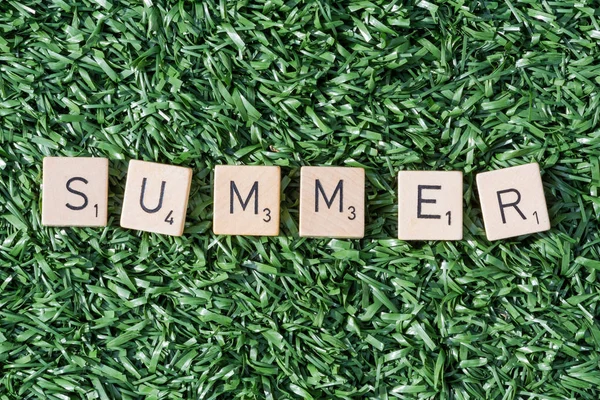 Summer letters on synthetic grass