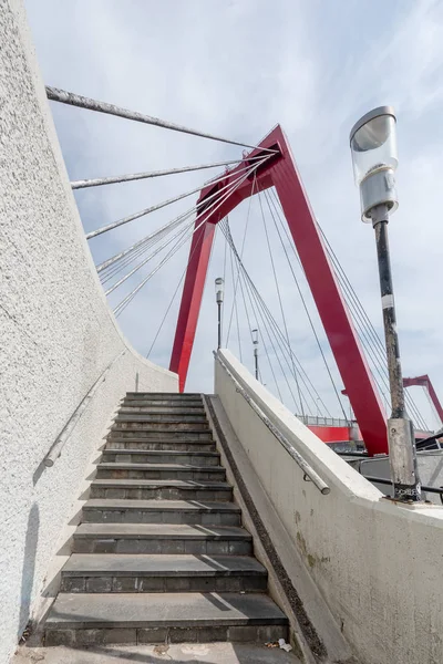 Red cable bridge against blue sky and white clouds — Stock Photo, Image