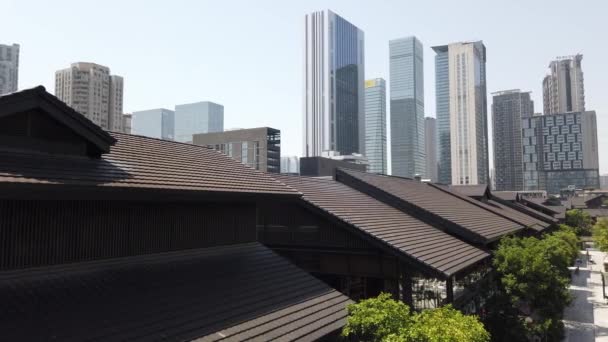 Roofs of shops and skyscrapers in Taikooli commercial area on a sunny day in Chengdu — Stock Video