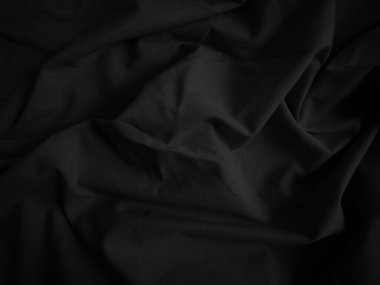 Siyah buruşuk kumaş dokusu. Koyu renk arka plan