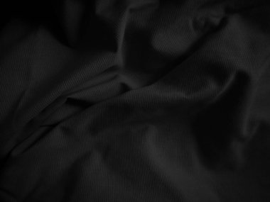 Siyah buruşuk kumaş dokusu. Koyu renk arka plan