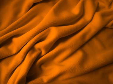 Turuncu buruşuk kumaş arkaplan. Dalgalı kumaş dokusu