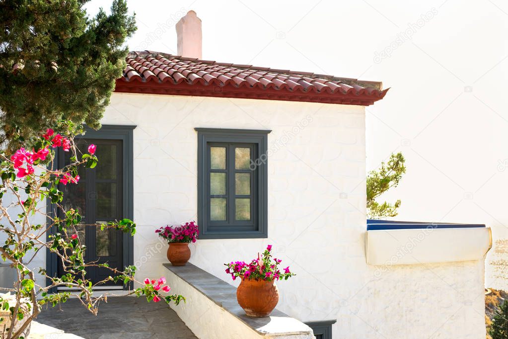 Traditional Greece white house and flowers