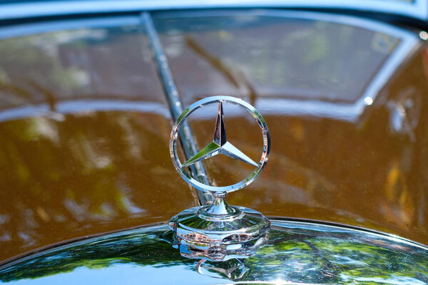 Berlin, Germany- june 09, 2018: Car design detail and  Mercedes Benz star logo / brand name closeup at Oldtimer automobile event in Berlin