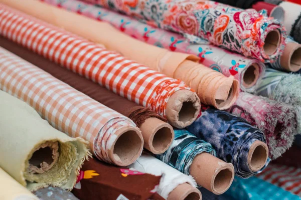 Rolls of  fabrics and textiles. Sewing and fashion industry conc — Stock Photo, Image