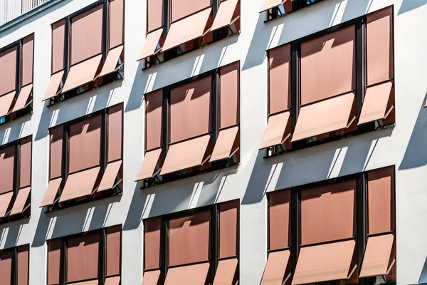 sun blinds on building facade , modern sunshades / awnings