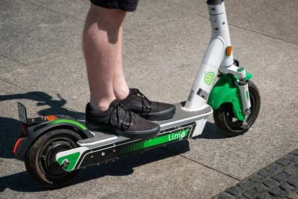 Man riding an electric scooter , escooter or e-scooter of the ri — Stock Photo, Image