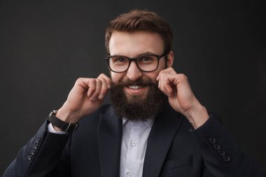 Cheerful elegant man curling mustache clipart