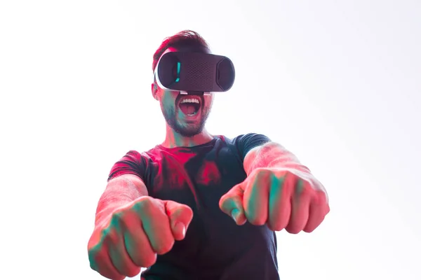 Cheerful man in VR glasses gaming — Stock Photo, Image