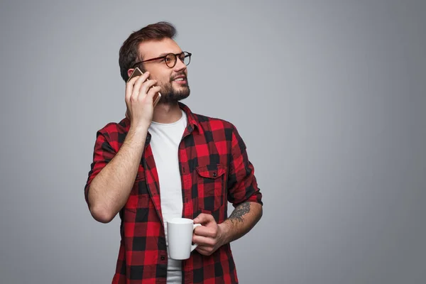Stylish hipster man with coffee and smartphone — Stock Photo, Image