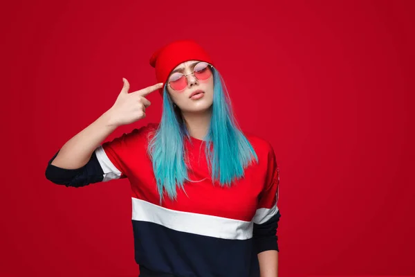 Young female with finger gun near temple — Stock Photo, Image