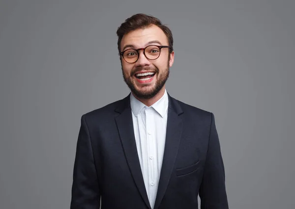 Cheerful businessman looking ar camera — Stock Photo, Image