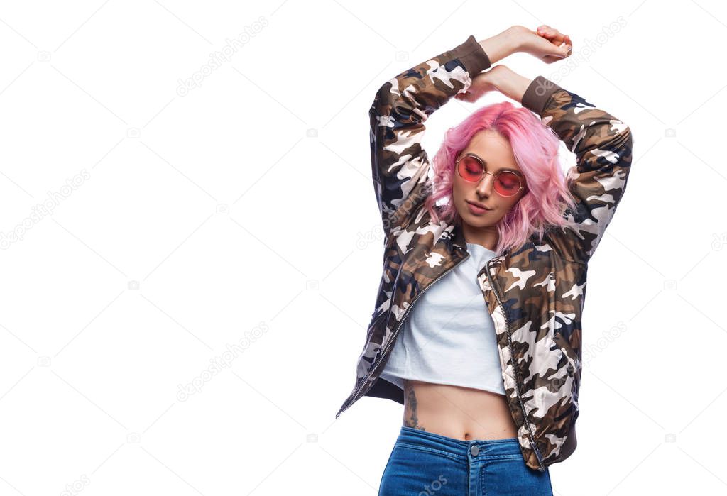 Stylish woman dancing with closed eyes