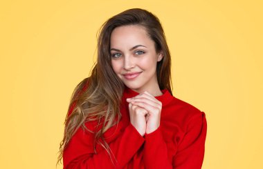 Cute female clasping hands